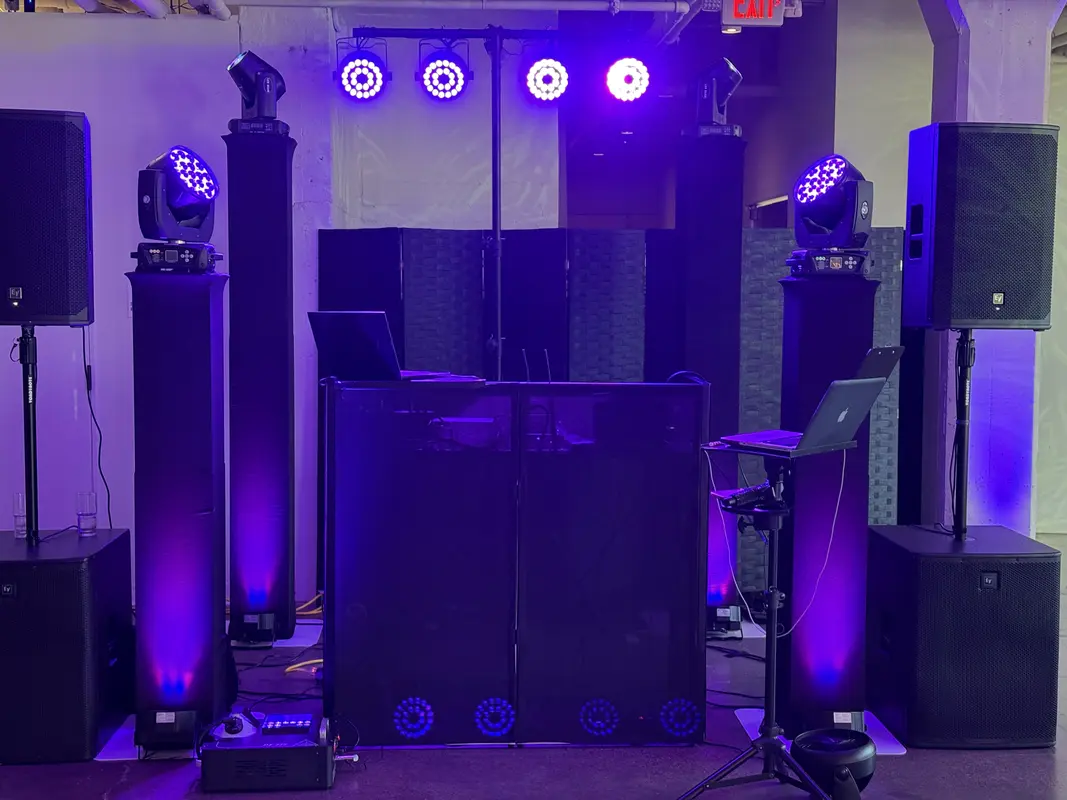 Full DJ booth with moving head lights, speakers and subwoofers