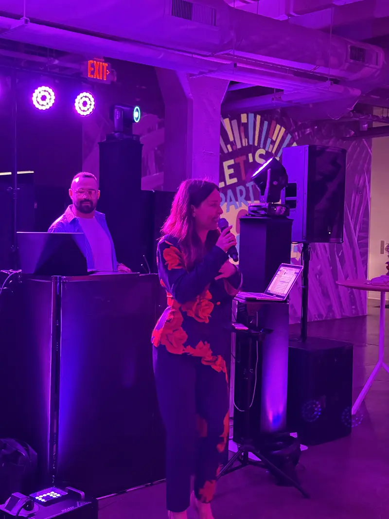 DJ and vocalist performing at a private party with full audio rig