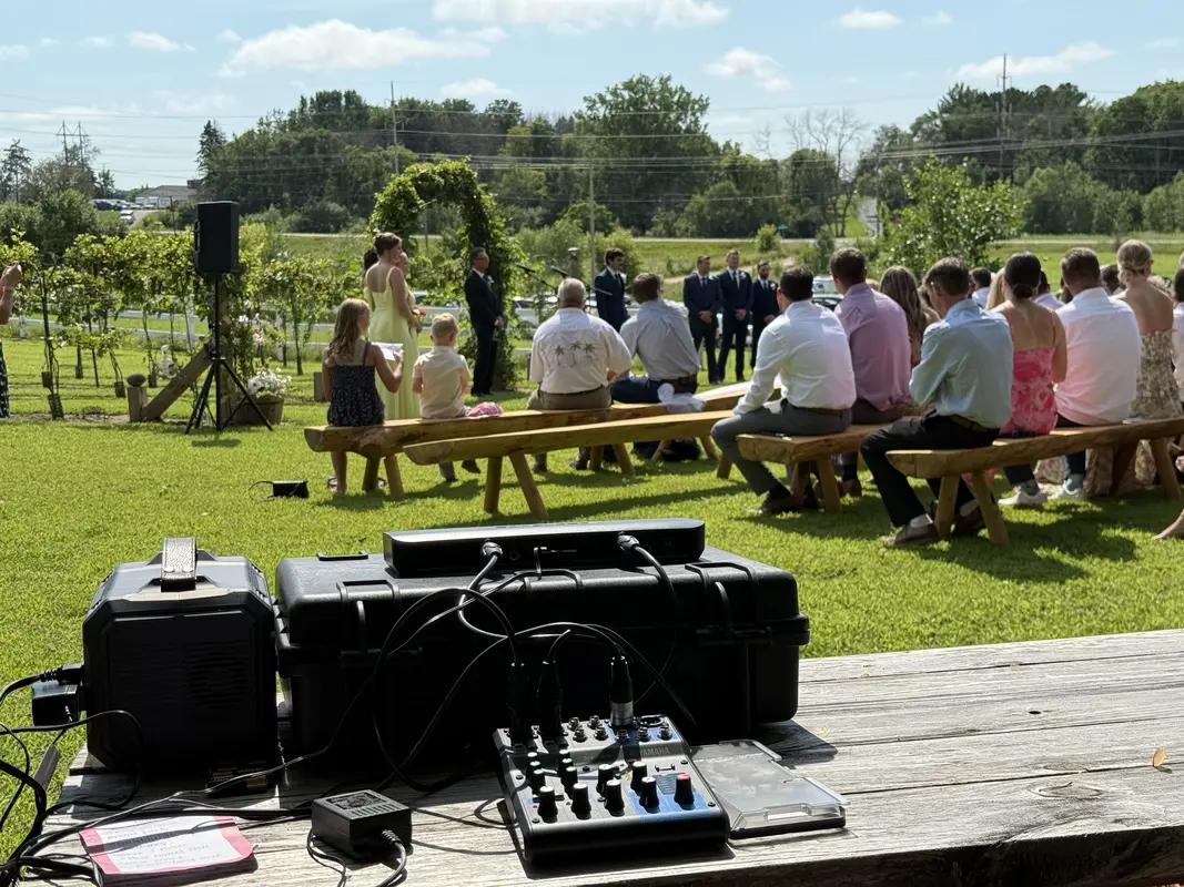 Wedding ceremony sound system setup at a vineyard