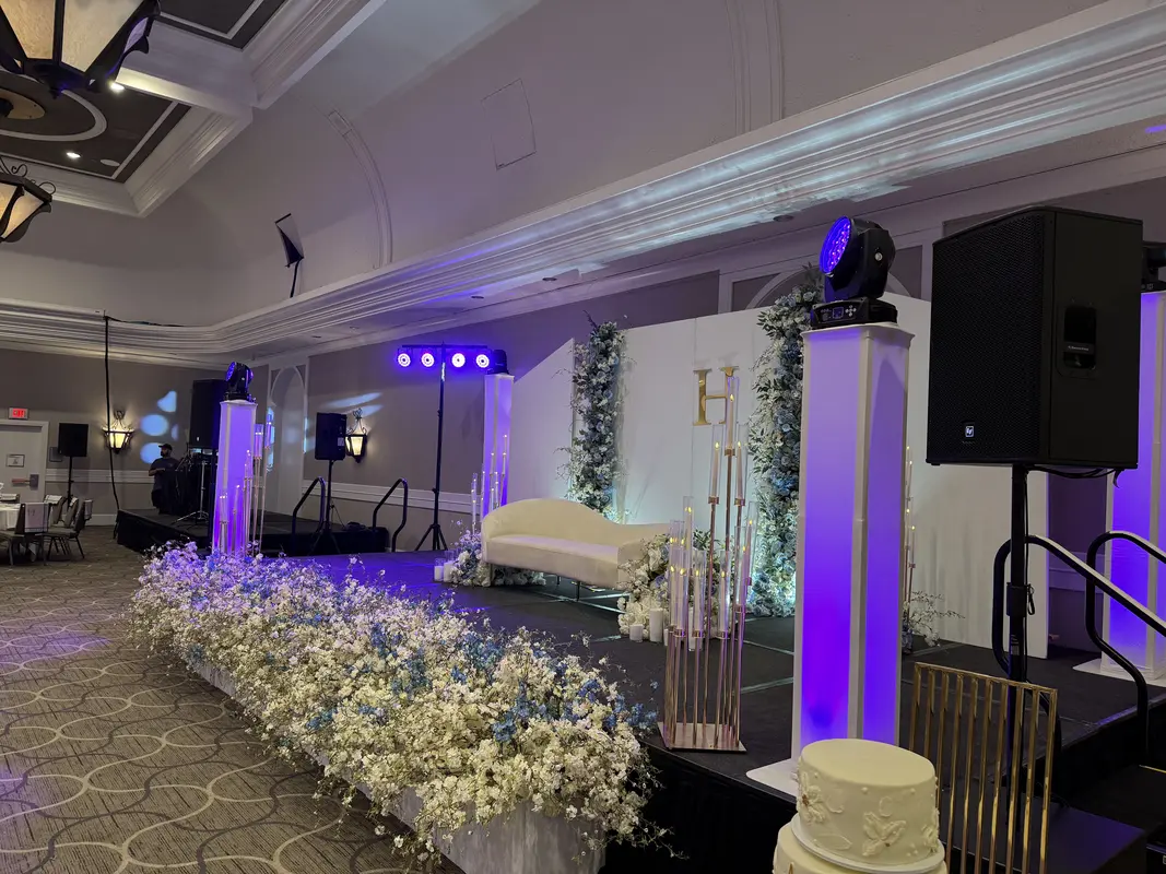 Speaker and subwoofer rental setup at a ballroom event