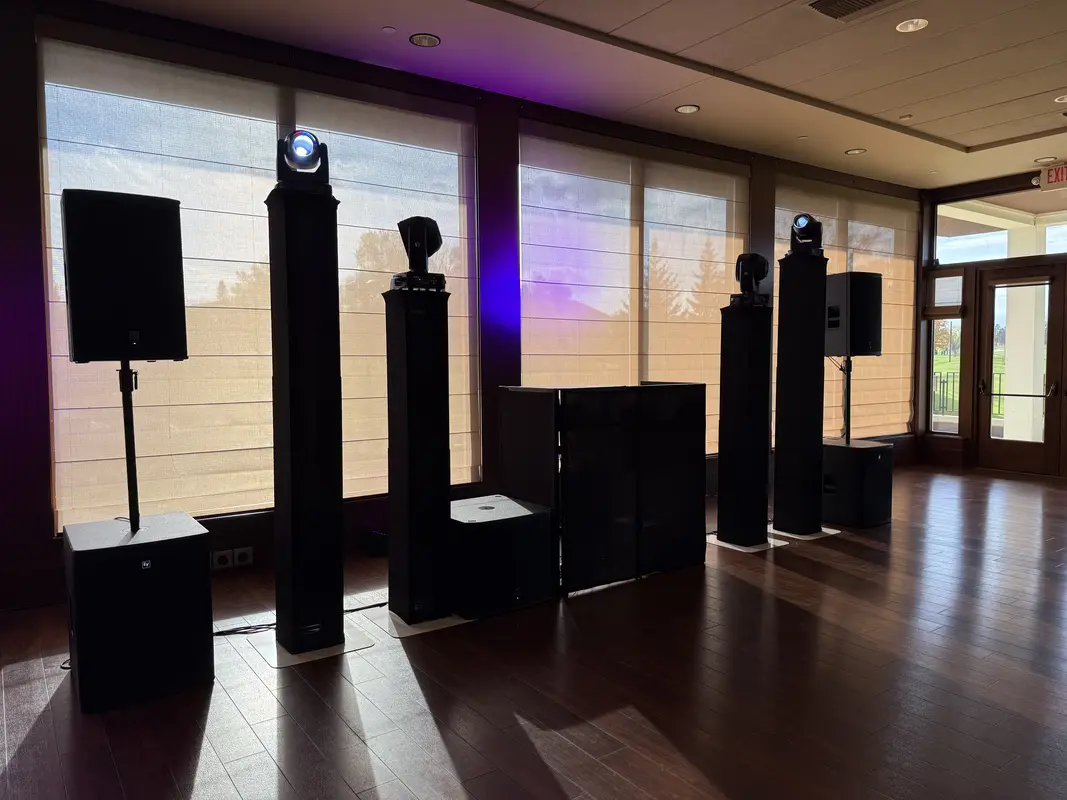 Wedding venue with uplighting, moving heads, speakers and floral decorations