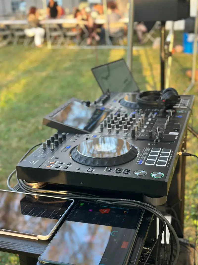 Professional DJ controller setup at an outdoor event